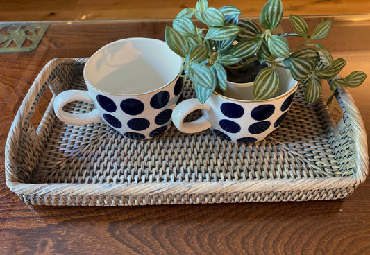 A small handmade rattan morning  tray in a natural and grey weave 33 x 20 x 5 cm